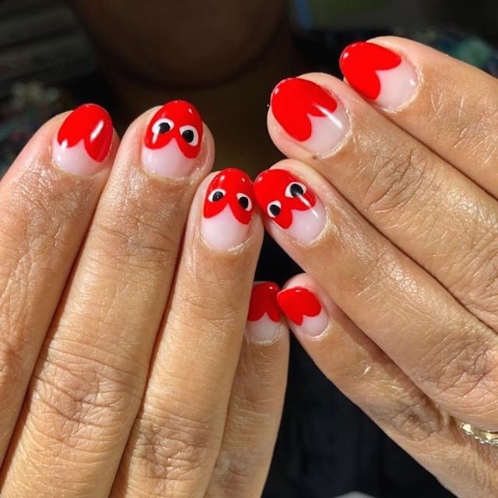 Nail art with half heart designs by Penny Nail.