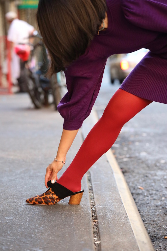 National Legwear Day with red tights and a purple dress outside in New York City.