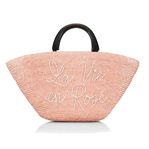 Light pink straw tote with the words La Vie en Rose in front, set on a white background.
