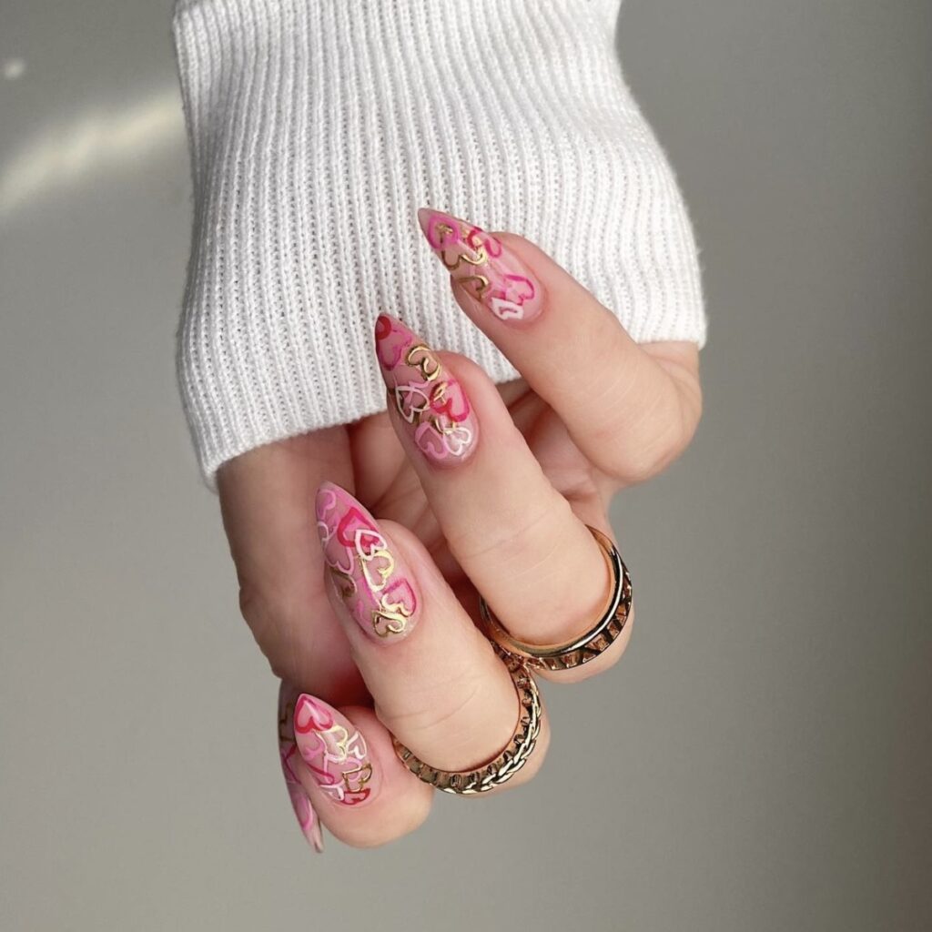 long-length valentines day nails with graffiti hearts designs.