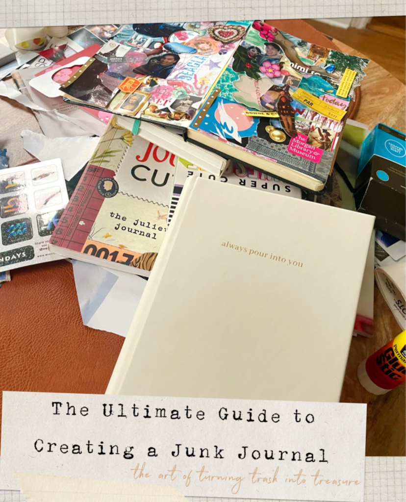 A junk journal made for 2026 goals, surrounded by supplies including paper, and glue on a table