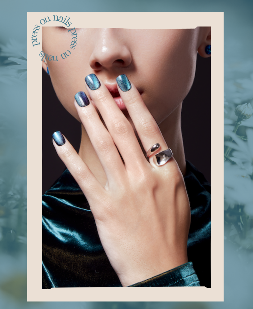 close up of shiny press-on nails on a green background