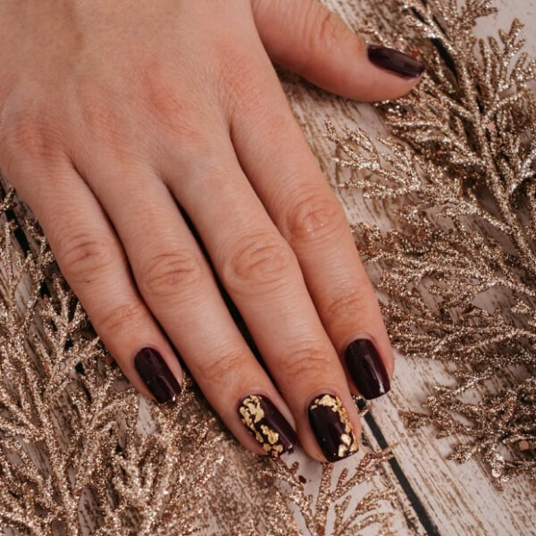 Autumn nails with wine color shade and gold sparkles