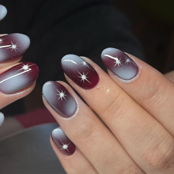 Dark coquette manicure on a black background