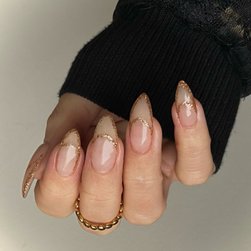 new years nails with pink outline glitter tips.
