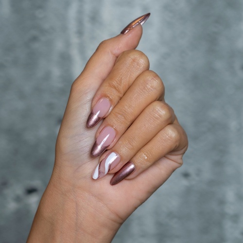 pink nail art with a white swirl detail on the ring finger.