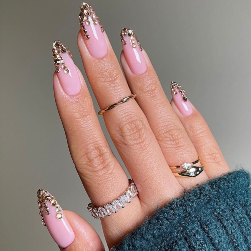 rose gold nails with pink rhinestone tip.