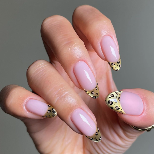 pink velvet nails with cheetah print tips.