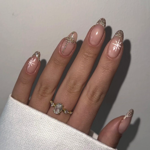 winter pink nails with snowflake designs.