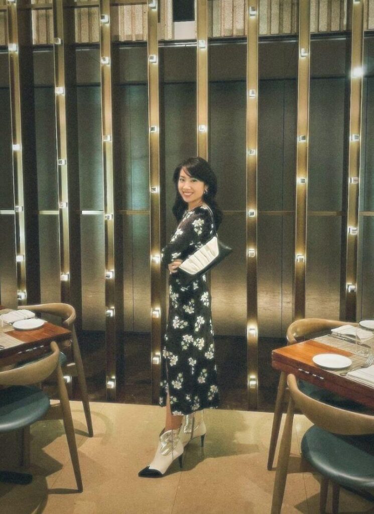Outfit of the day with a navy floral dress and black and white shoes.