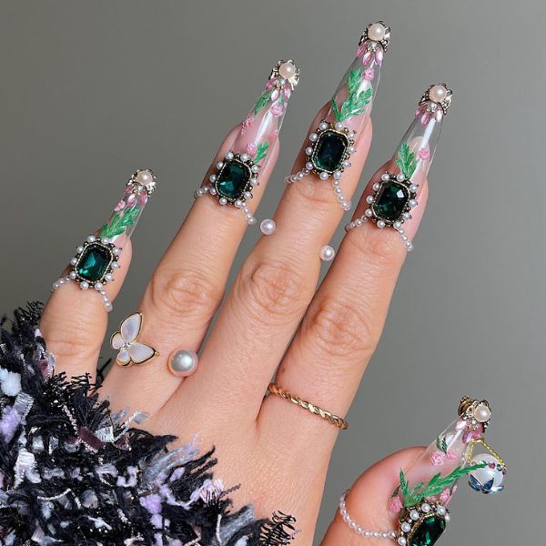 Dark green Christmas nail designs with diamonds and pearls