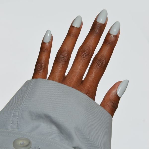 Grey holiday nails on a light gray background