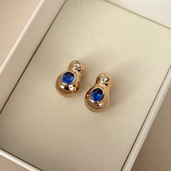 A pair of gold earrings, a small luxury gift for her