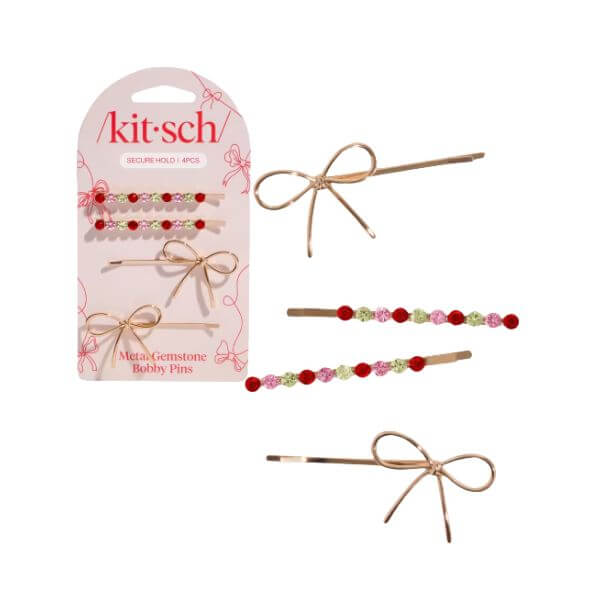 Set of bow and gemstone hair clips on a white background
