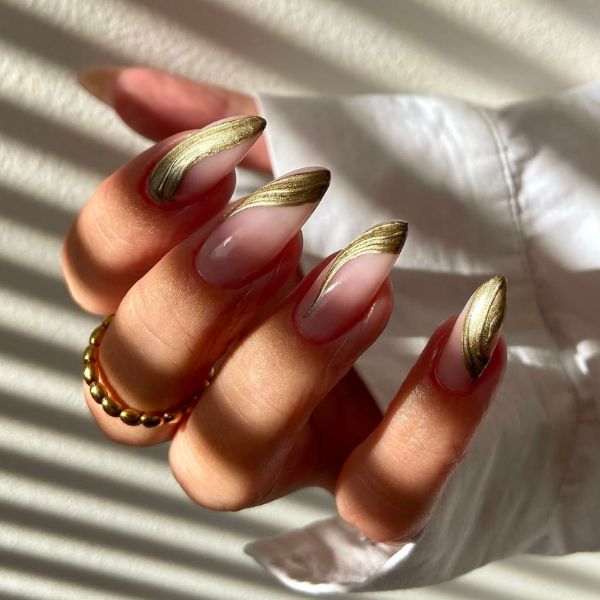Gold New Year's nails on a white background.