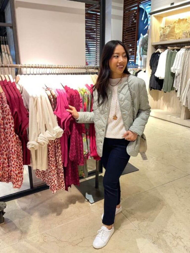 Light green jacket with a background of a store