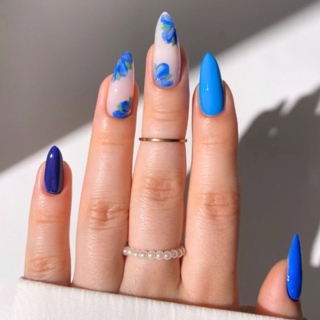 Blue and flower nails with a white background.