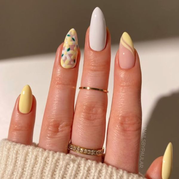 butter yellow nails on a beige background.