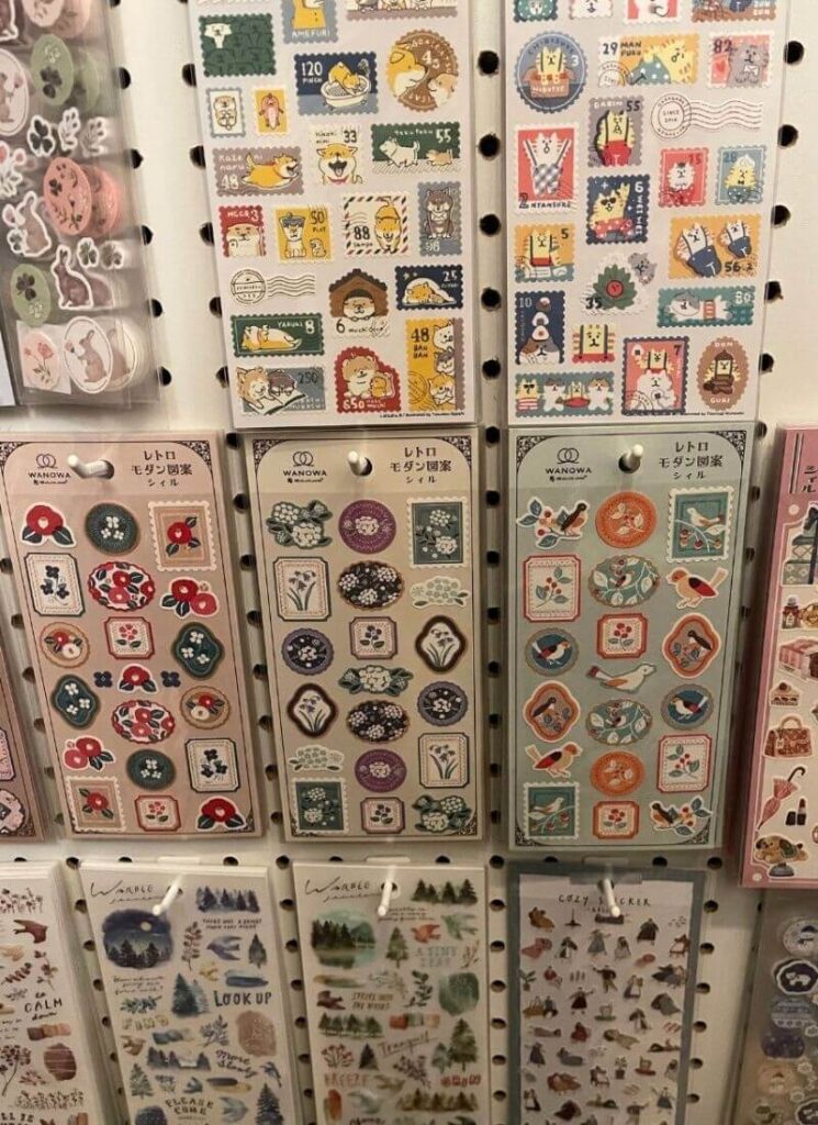 Packets of bright stickers on a wall used as scrapbooking supplies.