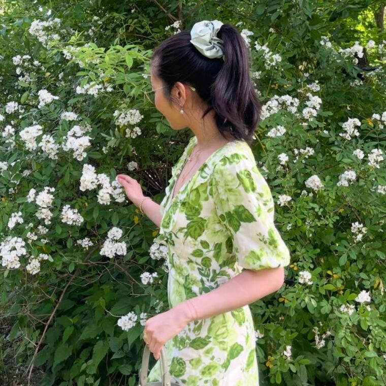 Picking flowers in a field, a top activity in summer bucket list ideas.