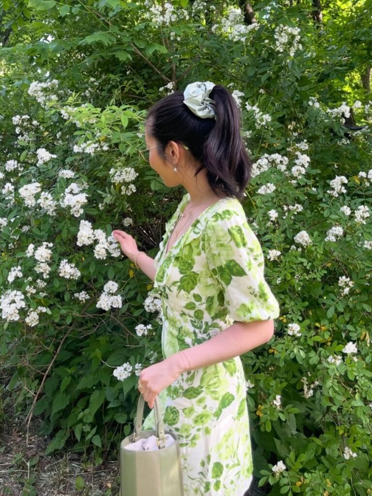 Picking flowers in a field, a top activity in summer bucket list ideas.