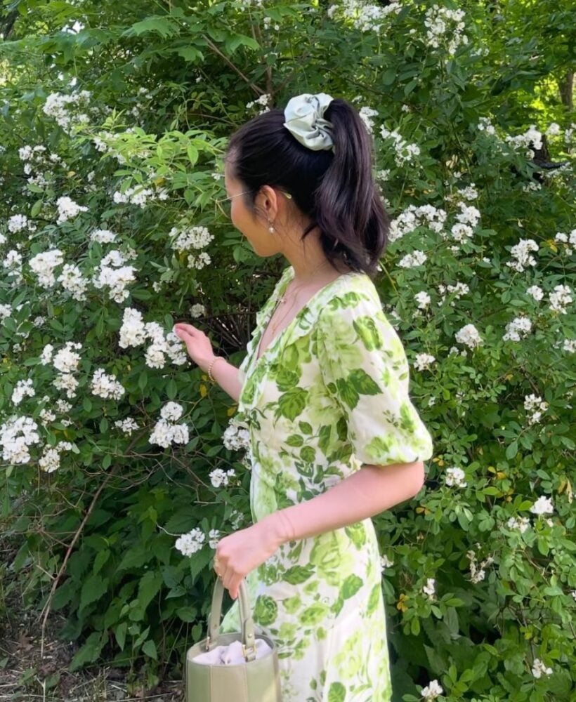 Picking flowers in a field, a top activity in summer bucket list ideas.