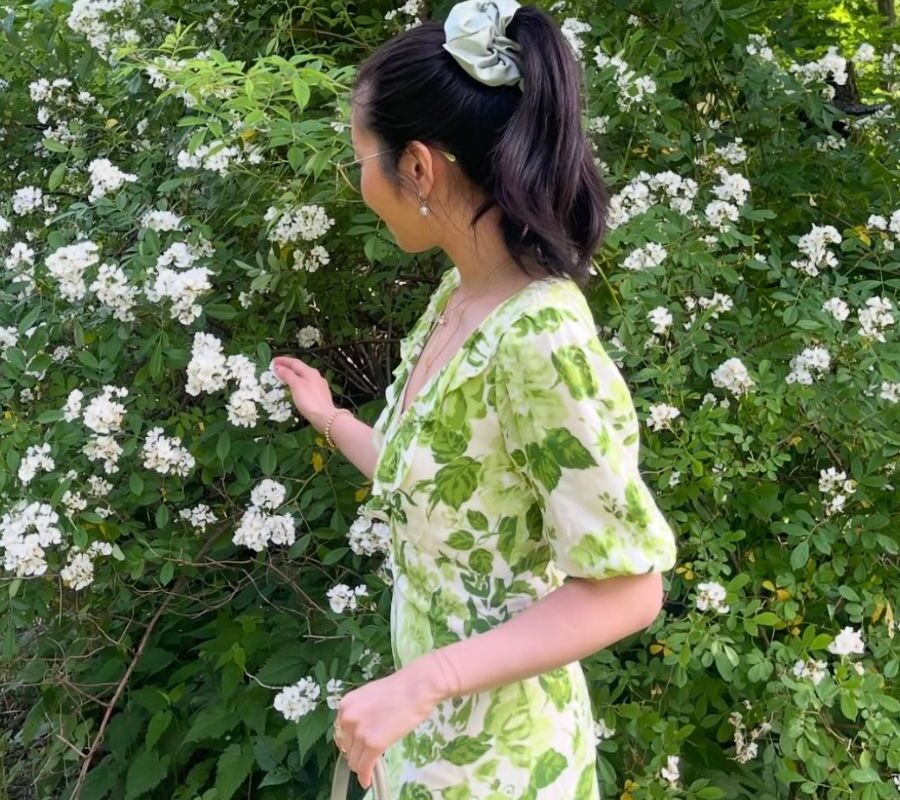 Picking flowers in a field, a top activity in summer bucket list ideas.