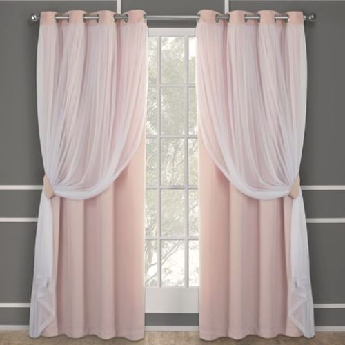 Sheer and solid pink curtains layered to create a warm, inviting atmosphere.